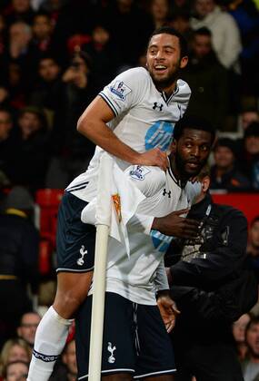 Emmanuel Adebayor of Tottenham celebrates his goal with Mousa Dembele of Tottenham - Barclays Premier League - Manchester Utd vs Tottenham - Old Trafford Stadium - Manchester - England - 1st January 2014 - Picture Simon Bellis Sportimage EDITORIAL USE ONLY. No use with unauthorised audio, video, data, fixture lists, club league logos or live services. Online in-match use limited to 120 images, no video emulation. No use in betting, games or single club league player publications.