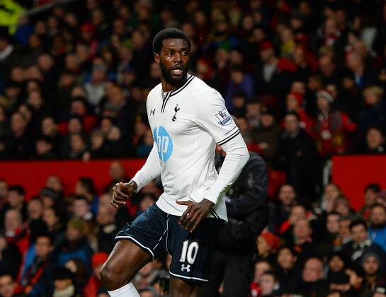 Emmanuel Adebayor of Tottenham celebrates scoring with a header - Barclays Premier League - Manchester Utd vs Tottenham - Old Trafford Stadium - Manchester - England - 1st January 2014 - Picture Simon Bellis Sportimage EDITORIAL USE ONLY. No use with unauthorised audio, video, data, fixture lists, club league logos or live services. Online in-match use limited to 120 images, no video emulation. No use in betting, games or single club league player publications.