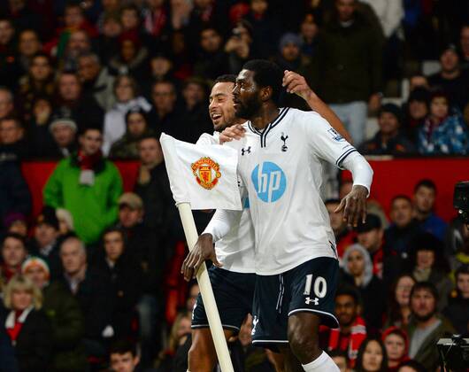 Emmanuel Adebayor of Tottenham celebrates scoring with a header - Barclays Premier League - Manchester Utd vs Tottenham - Old Trafford Stadium - Manchester - England - 1st January 2014 - Picture Simon Bellis Sportimage EDITORIAL USE ONLY. No use with unauthorised audio, video, data, fixture lists, club league logos or live services. Online in-match use limited to 120 images, no video emulation. No use in betting, games or single club league player publications.