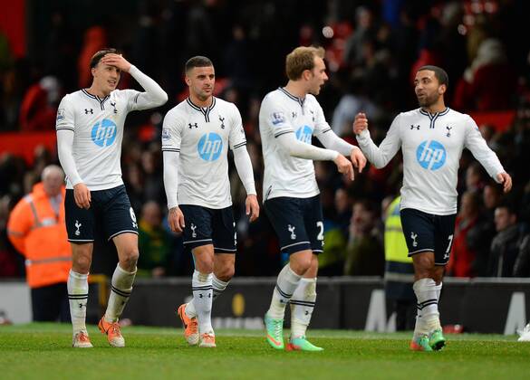 Tottenham players walk off happy at the end - Barclays Premier League - Manchester Utd vs Tottenham - Old Trafford Stadium - Manchester - England - 1st January 2014 - Picture Simon Bellis Sportimage EDITORIAL USE ONLY. No use with unauthorised audio, video, data, fixture lists, club league logos or live services. Online in-match use limited to 120 images, no video emulation. No use in betting, games or single club league player publications.