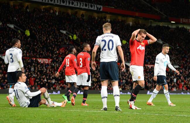 Dejection for Nemanja Vidic of Manchester United as a header goes over in the last minutes - Barclays Premier League - Manchester Utd vs Tottenham - Old Trafford Stadium - Manchester - England - 1st January 2014 - Picture Simon Bellis Sportimage EDITORIAL USE ONLY. No use with unauthorised audio, video, data, fixture lists, club league logos or live services. Online in-match use limited to 120 images, no video emulation. No use in betting, games or single club league player publications.