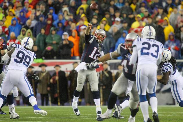 New England Patriots quarterback Tom Brady (12) throws a pass in the first quarter of the AFC Divisional Playoff at Gillette Stadium in Foxboro, Massachusetts on January 11, 2014.  BOS2014011105