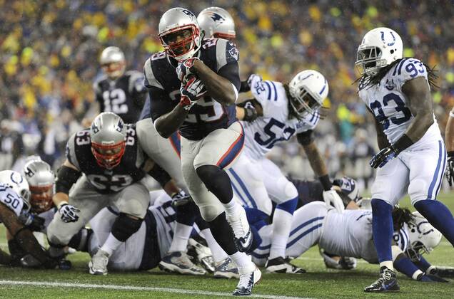 New England Patriots running back LeGarrette Blount (29) charges into the end zone on a two-yard carry in the first quarter against the Indianapolis Colts in the AFC Divisional Playoff game at Gillette Stadium in Foxboro, Massachusetts on January 11, 2014. The Patriots defeated the Colts 43-22.  BOS2014011112