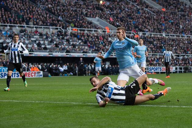 Edin Dzeko of Manchester City scores the opening goal - Newcastle United vs. Manchester City - Barclays Premier League - St James Park - Newcastle - 12 01 2014 EDITORIAL USE ONLY. No use with unauthorised audio, video, data, fixture lists, club league logos or live services. Online in-match use limited to 120 images, no video emulation. No use in betting, games or single club league player publications.
