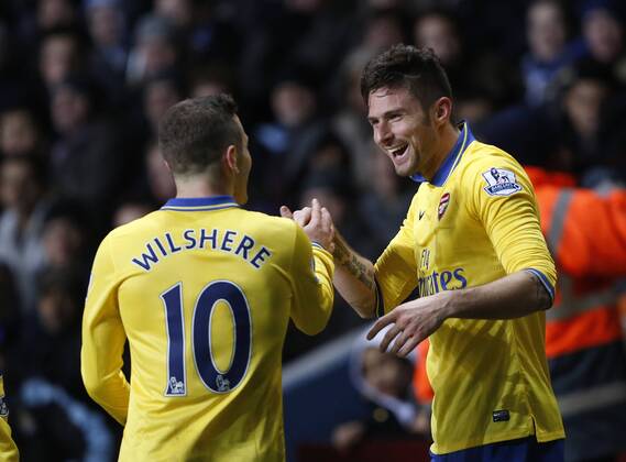 Arsenal s Olivier Giroud celebrates scoring his sides second goal with Jack Wilshere Aston Villa - Arsenal FC London. Premier League - Villa Park- Birmingham - England - 13 01 2014 - PicxDavidxKleinxSportimagex EDITORIAL USE ONLY. No use with unauthorised audio, video, data, fixture lists, club league logos or live services. Online in-match use limited to 120 images, no video emulation. No use in betting, games or single club league player publications.