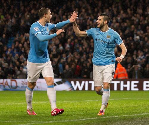 Alvaro Negredo of Manchester City celebrates his opening goal - Manchester City vs. Blackburn Rovers - FA Cup Third Round Replay - Etihad Stadium - Manchester - 15 01 2014 Pic Philip Oldham Sportimage EDITORIAL USE ONLY. No use with unauthorised audio, video, data, fixture lists, club league logos or live services. Online in-match use limited to 120 images, no video emulation. No use in betting, games or single club league player publications.