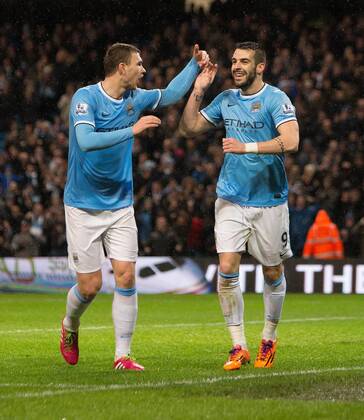 Alvaro Negredo of Manchester City celebrates his opening goal - Manchester City vs. Blackburn Rovers - FA Cup Third Round Replay - Etihad Stadium - Manchester - 15 01 2014 Pic Philip Oldham Sportimage EDITORIAL USE ONLY. No use with unauthorised audio, video, data, fixture lists, club league logos or live services. Online in-match use limited to 120 images, no video emulation. No use in betting, games or single club league player publications.