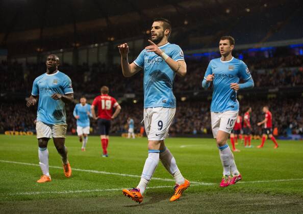 Alvaro Negredo of Manchester City celebrates his opening goal - Manchester City vs. Blackburn Rovers - FA Cup Third Round Replay - Etihad Stadium - Manchester - 15 01 2014 Pic Philip Oldham Sportimage EDITORIAL USE ONLY. No use with unauthorised audio, video, data, fixture lists, club league logos or live services. Online in-match use limited to 120 images, no video emulation. No use in betting, games or single club league player publications.
