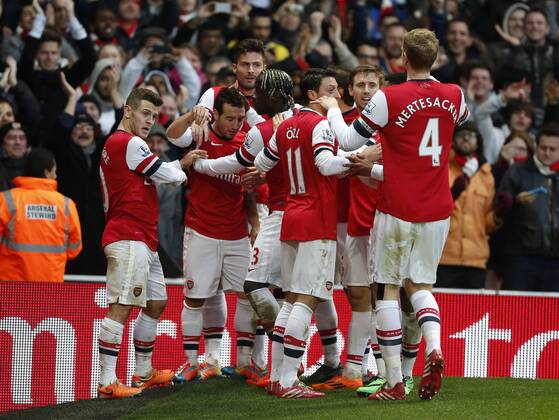 Arsenal s Santi Cazorla acelebrates scoring his sides opening goal - Arsenal FC London vs Fulham FC - - Premier League - Emirates Stadium- London - England - 18 01 2014 - Pic DavidKlein Sportimage EDITORIAL USE ONLY. No use with unauthorised audio, video, data, fixture lists, club league logos or live services. Online in-match use limited to 120 images, no video emulation. No use in betting, games or single club league player publications.