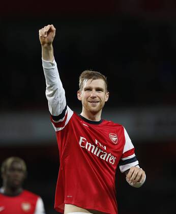Arsenal s Per Mertesacker celebrates at the final whistle - FC Arsenal vs FC Fulham - - Premier League - Emirates Stadium- London - England - 18 01 2014 - Pic David Klein Sportimage EDITORIAL USE ONLY. No use with unauthorised audio, video, data, fixture lists, club league logos or live services. Online in-match use limited to 120 images, no video emulation. No use in betting, games or single club league player publications.
