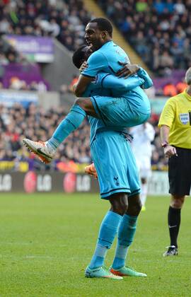 Emmanuel Adebayor of Tottenham celebrates the third goal with Danny Rose of Tottenham - Barclays Premier League - Swansea City vs Tottenham Hotspur - Liberty Stadium - Swansea - Wales - 19th January 2014 - EDITORIAL USE ONLY. No use with unauthorised audio, video, data, fixture lists, club league logos or live services. Online in-match use limited to 120 images, no video emulation. No use in betting, games or single club league player publications.