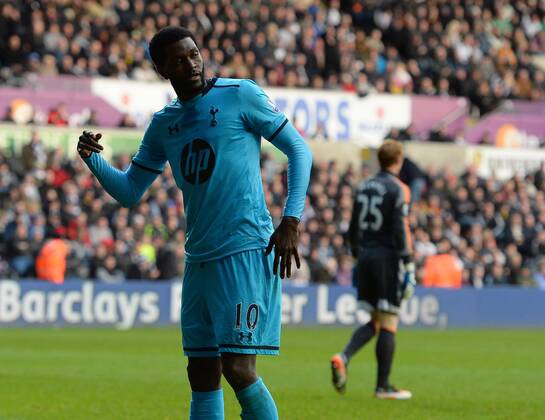 Emmanuel Adebayor of Tottenham celebrates scoring the third goal- Barclays Premier League - Swansea City vs Tottenham Hotspur - Liberty Stadium - Swansea - Wales - 19th January 2014 - EDITORIAL USE ONLY. No use with unauthorised audio, video, data, fixture lists, club league logos or live services. Online in-match use limited to 120 images, no video emulation. No use in betting, games or single club league player publications.