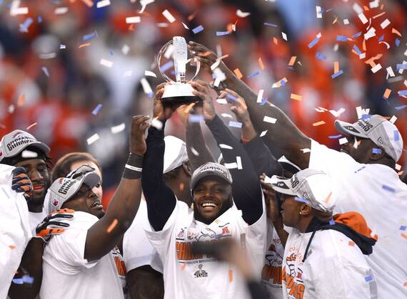 Jan. 18, 2014 - Denver, CO, USA - Broncos players celebrate with the trophy following the AFC championship game at Sports Authority Field at Mile High in Denver on Sunday, Jan. 19, 2014. The Denver Broncos defeated the New England Patriots, 26-16. BRONCOS PATRIOTS - ZUMAm67