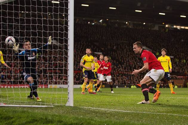 Jonny Evans of Manchester United opens the scoring with the first goal - Manchester United vs. Sunderland - Capital One Cup Semi Final Second Leg - Old Trafford - Manchester - 22 01 2014 Pic Philip Oldham Sportimage EDITORIAL USE ONLY. No use with unauthorised audio, video, data, fixture lists, club league logos or live services. Online in-match use limited to 120 images, no video emulation. No use in betting, games or single club league player publications.