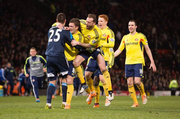 Sunderland FC mob Vito Mannone as he secures victory in the penalty shoot out - Manchester United (ManU) vs. Sunderland FC - Capital One Cup Semi Final Second Leg - Old Trafford - Manchester - 22 01 2014 Pic Philip Oldham Sportimage EDITORIAL USE ONLY. No use with unauthorised audio, video, data, fixture lists, club league logos or live services. Online in-match use limited to 120 images, no video emulation. No use in betting, games or single club league player publications.
