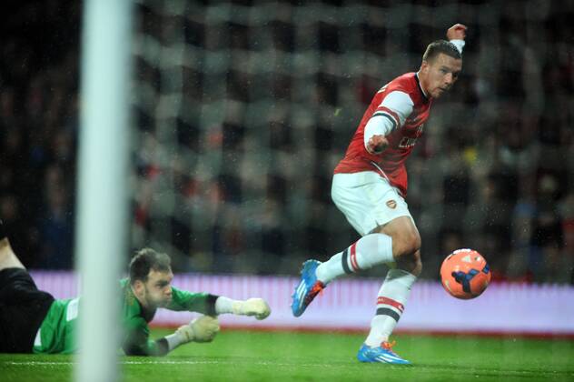 Football - 2013 2014 FA Cup - Fourth Round: Arsenal vs. Coventry City Arsenal s Lukas Podolski scores goal no 1 at The Emirates. COLORSPORT ANDREW COWIE