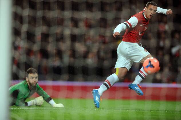 Football - 2013 2014 FA Cup - Fourth Round: Arsenal vs. Coventry City Arsenal s Lukas Podolski scores goal no 1 at The Emirates. COLORSPORT ANDREW COWIE