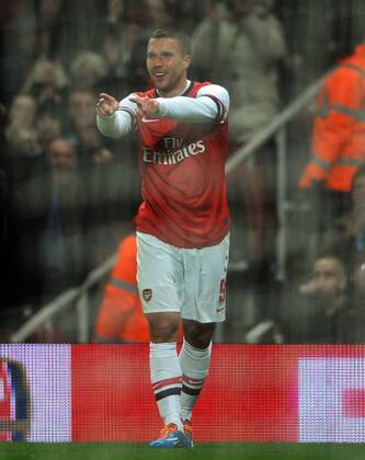 Football - 2013 2014 FA Cup - Fourth Round: Arsenal vs. Coventry City Arsenal s Lukas Podolski celebrates scoring goal no 1 at The Emirates. COLORSPORT ANDREW COWIE