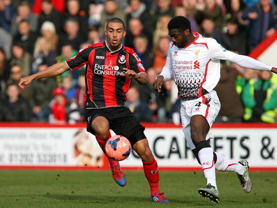 Football - 2013 2014 FA Cup - Fourth Round: AFC Bournemouth vs. Liverpool FC Kolo Toure of Liverpool and Bournemouth s Lewis Grabban tussle for a lose ball at Dean Court The Goldsands Stadium Colorsport ShaunxBoggust
