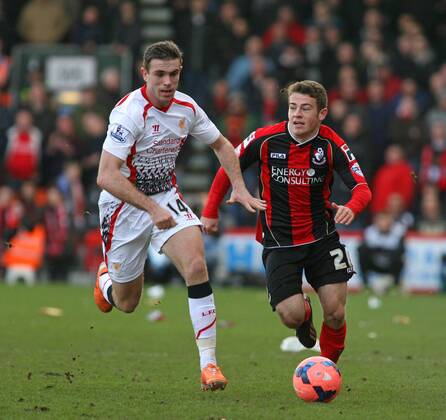 Football - 2013 2014 FA Cup - Fourth Round: AFC Bournemouth vs. Liverpool FC Bournemouth s Ryan Fraser and Jordan Henderson of Liverpool chase down a lose ball at Dean Court The Goldsands Stadium Colorsport ShaunxBoggust