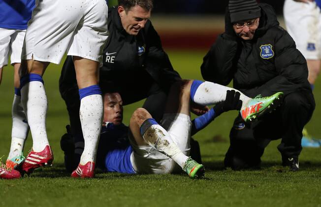 Everton s Bryan Oviedo looks on in shock as he breaks his ankle Stevenage vs Everton - FA Cup Fourth Round - Broadhall Way- Stevenage - England - 25 01 2014 - EDITORIAL USE ONLY. No use with unauthorised audio, video, data, fixture lists, club league logos or live services. Online in-match use limited to 120 images, no video emulation. No use in betting, games or single club league player publications.