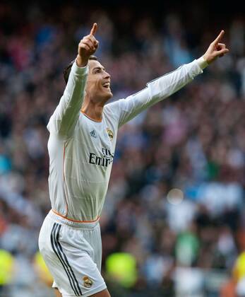 Real Madrid s Cristiano Ronaldo celebrates his goal during the Spanish first division soccer match against Granada in Madrid Jan. 25, 2014. Real Madrid won the match 2-0. (Xinhua Xie Haining) (SP)SPAIN-MADRID-SOCCER-SPANISH FIRST DIVISION