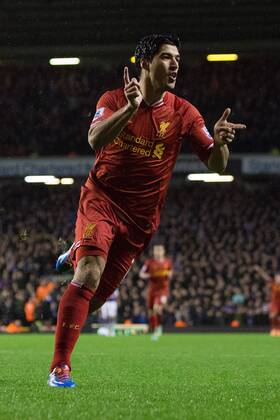 Luis Suarez of Liverpool celebrates scoring his sides fourth goal - Liverpool FC vs. Everton FC - Barclays Premier League - Anfield - Liverpool - 28 01 2014 EDITORIAL USE ONLY. No use with unauthorised audio, video, data, fixture lists, club league logos or live services. Online in-match use limited to 120 images, no video emulation. No use in betting, games or single club league player publications.