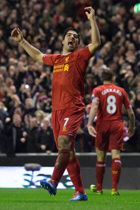 Luis Suarez of Liverpool celebrates scoring his sides fourth goal - Liverpool FC vs. Everton FC - Barclays Premier League - Anfield - Liverpool - 28 01 2014 EDITORIAL USE ONLY. No use with unauthorised audio, video, data, fixture lists, club league logos or live services. Online in-match use limited to 120 images, no video emulation. No use in betting, games or single club league player publications.