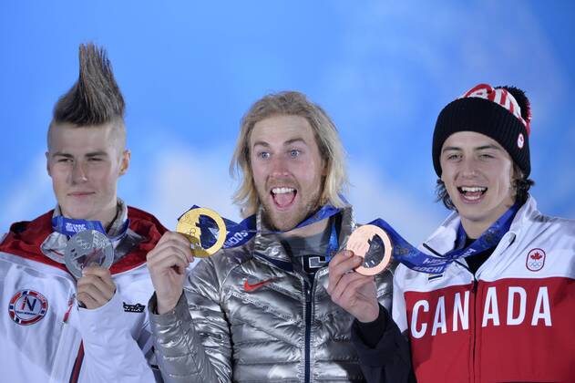 Silver-medalist Staale Sandbech (L-R) of Norway, gold-medalist Sage Kotsenburg of the the United States and bronze medalist Mark McMorris of Canada celebrate during their Victory Ceremony for the Men s Slopestyle at the Sochi 2014 Winter Olympics on February 8, 2014 in Sochi, Russia.  OLY20140208133