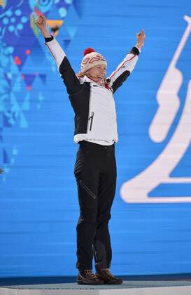Slovokia s Anastasiya Kuzmina celebrates her gold medal win during the victory ceremony for the biathalon Women s Sprint at the Sochi 2014 Winter Olympics on February 10, 2014 in Sochi, Russia.  OLY20140210130