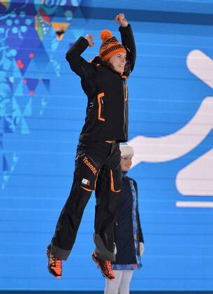 The Netherland s Ireen Wüst celebrates before being presented with a gold medal during the victory ceremony for ladies 3000M speed skating at the Sochi 2014 Winter Olympics on February 10, 2014 in Sochi, Russia.  OLY20140210156