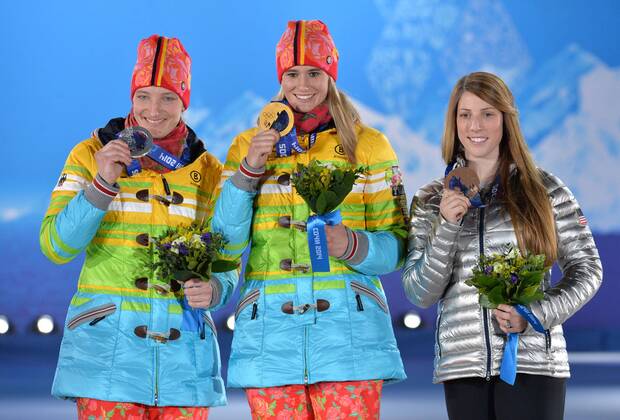 From left to right, silver medalist Germany s Tatjana Hüfner, gold medalist Germany s Natalie Geisenberger and bronze medalist United State s Erin Hamlin pose during the victory ceremony for luge women s single at the Sochi 2014 Winter Olympics on February 12, 2014 in Sochi, Russia.  OLY20140212375