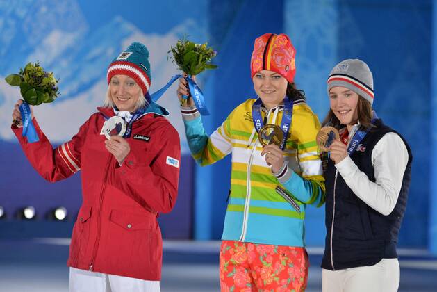 From left to right, silver medalist Austria s Daniela Iraschko-Stolz, gold medalist Germany s Carina Vogt and bronze medalist France s Coline Mattel during the victory ceremony for the ski jumping ladies normal hill individual at the Sochi 2014 Winter Olympics on February 12, 2014 in Sochi, Russia.  OLY20140212380