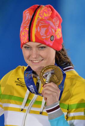 Gold medalist Germany s Carina Vogt poses with her medal during the victory ceremony for the ski jumping ladies normal hill individual at the Sochi 2014 Winter Olympics on February 12, 2014 in Sochi, Russia.  OLY20140212381