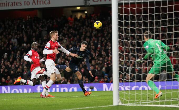 Arsenal s Wojciech Szczesny saves from Manchester United s Robin Van Persie Arsenal London s vs Manchester United (ManU) - Premier League - Emirates Stadium - London - England - 12 02 2014 - Pic DavidKlein Sportimage EDITORIAL USE ONLY. No use with unauthorised audio, video, data, fixture lists, club league logos or live services. Online in-match use limited to 120 images, no video emulation. No use in betting, games or single club league player publications.