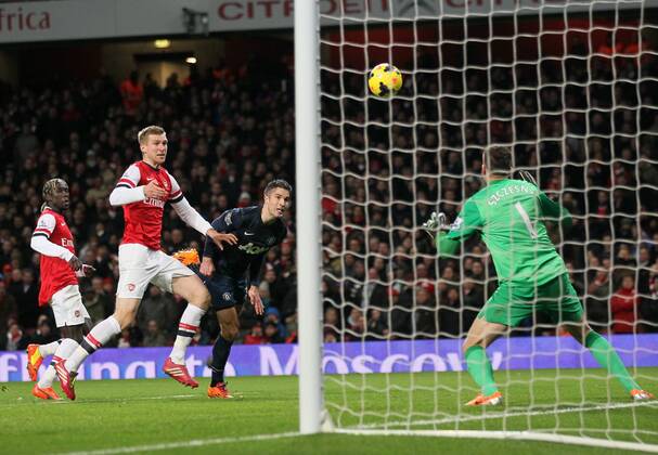 Arsenal s Wojciech Szczesny saves from Manchester United s Robin Van Persie Arsenal London s vs Manchester United (ManU) - Premier League - Emirates Stadium - London - England - 12 02 2014 - Pic DavidKlein Sportimage EDITORIAL USE ONLY. No use with unauthorised audio, video, data, fixture lists, club league logos or live services. Online in-match use limited to 120 images, no video emulation. No use in betting, games or single club league player publications.