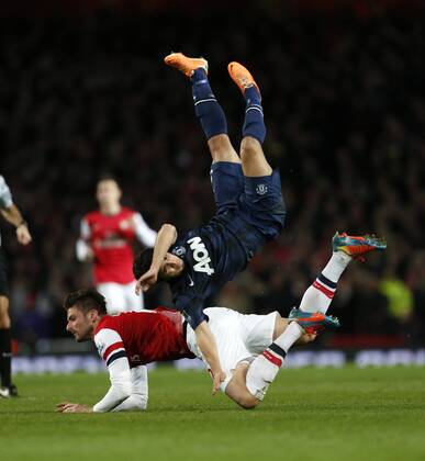 Arsenal s Olivier Giroud clashes with Manchester United s Rafael Arsenal London s vs Manchester United (ManU) - Premier League - Emirates Stadium - London - England - 12 02 2014 - Pic DavidKlein Sportimage EDITORIAL USE ONLY. No use with unauthorised audio, video, data, fixture lists, club league logos or live services. Online in-match use limited to 120 images, no video emulation. No use in betting, games or single club league player publications.