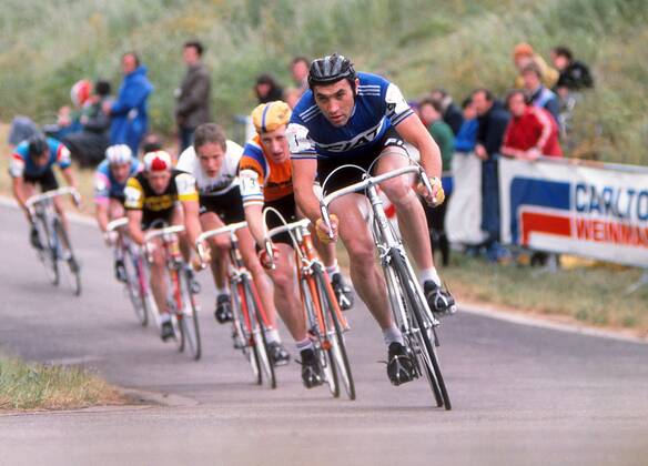 Road Cycling - 1977 Glenryck Cup Professional Criterium - Eastway Cycle Circuit Belgium s Eddy Merckx, with Great Britain s Keith Lambert behind his right shoulder, at Lee Valley Park, East London (later site of the Olympic VeloPark). The event was organised by boxing promoter Mike Barrett and was was informally known as the Merckx Meeting as it attracted arguably the greatest cyclist of all time - Eddy Merckx - as well as other top riders from the continent. 11 06 1977 