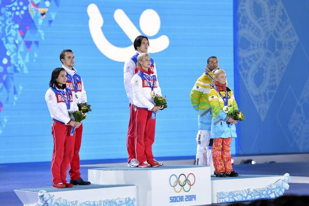 Left to right, Russia s Ksenia Stolbova and Fedor Klimov, Russia s Tatiana Volosozhar and Maxim Trankov and Germany s Aliona Savchenko and Robin Szolkowy pose with their silver, bronze and gold medals during the victory ceremony for figure skating pairs at the Sochi 2014 Winter Olympics on February 13, 2014 in Sochi, Russia.  OLY20140213464