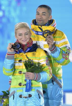 Germany s Aliona Savchenko and Robin Szolkowy pose with their bronze medals during the victory ceremony for figure skating pairs at the Sochi 2014 Winter Olympics on February 13, 2014 in Sochi, Russia.  OLY20140213462