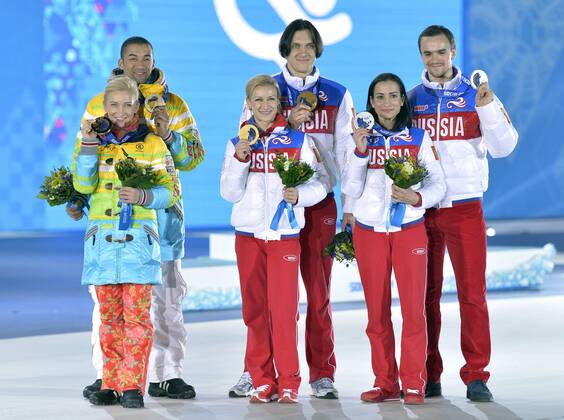 Left to right, Russia s Ksenia Stolbova and Fedor Klimov, Russia s Tatiana Volosozhar and Maxim Trankov and Germany s Aliona Savchenko and Robin Szolkowy pose with their silver, gold and bronze medals during the victory ceremony for figure skating pairs at the Sochi 2014 Winter Olympics on February 13, 2014 in Sochi, Russia.  OLY20140213463