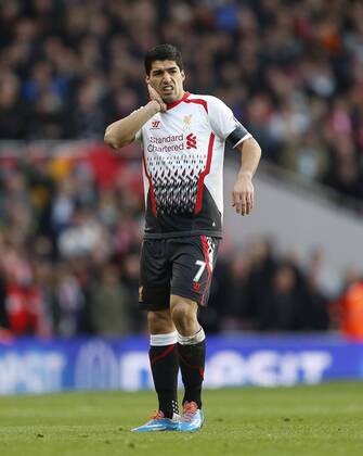 Liverpool s Luis Suarez looks on dejected Arsenal vs Liverpool - FA Cup Fifth Round - Emirates Stadium - London - England - 16 02 2014 - EDITORIAL USE ONLY. No use with unauthorised audio, video, data, fixture lists, club league logos or live services. Online in-match use limited to 120 images, no video emulation. No use in betting, games or single club league player publications.