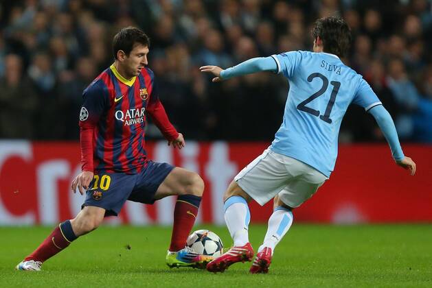 Lionel Messi of Barcelona takes on David Silva of Manchester City - UEFA Champions League First Knockout Round - Manchester City vs FC Barcelona - Etihad Stadium - Manchester - England - 18th February 2014 - Picture Dave Thompson Sportimage EDITORIAL USE ONLY. No use with unauthorised audio, video, data, fixture lists, club league logos or live services. Online in-match use limited to 120 images, no video emulation. No use in betting, games or single club league player publications.