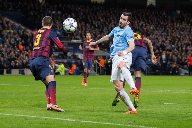 Alvaro Negredo of Manchester City sends a header just wide late in the first half - UEFA Champions League First Knockout Round - Manchester City vs Barcelona - Etihad Stadium - Manchester - England - 18th February 2014 - Picture Phil Oldham Sportimage EDITORIAL USE ONLY. No use with unauthorised audio, video, data, fixture lists, club league logos or live services. Online in-match use limited to 120 images, no video emulation. No use in betting, games or single club league player publications.