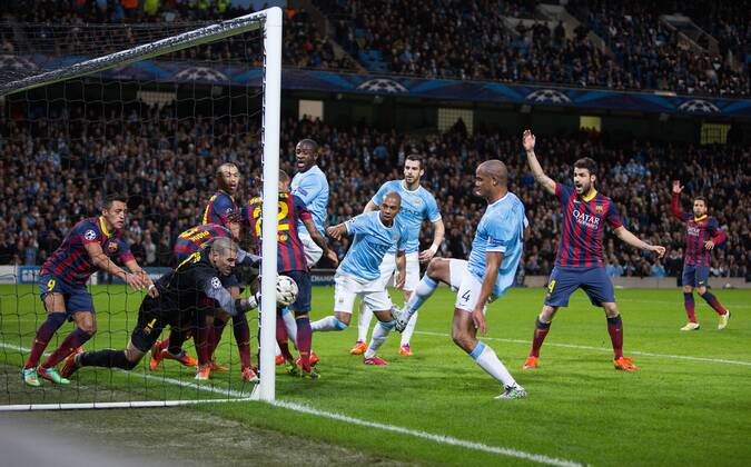 Victor Valdes of Barcelona struggles to reach a high ball during a goal mouth scramble - UEFA Champions League First Knockout Round - Manchester City vs Barcelona - Etihad Stadium - Manchester - England - 18th February 2014 - Picture Phil Oldham Sportimage EDITORIAL USE ONLY. No use with unauthorised audio, video, data, fixture lists, club league logos or live services. Online in-match use limited to 120 images, no video emulation. No use in betting, games or single club league player publications.