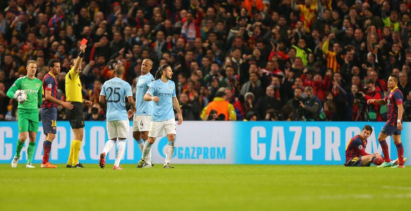 Martin Demichelis of Manchester City, centre, is sent off after fouling Lionel Messi of Barcelona, grounded right. - UEFA Champions League First Knockout Round - Manchester City vs FC Barcelona - Etihad Stadium - Manchester - England - 18th February 2014 - Picture Dave Thompson Sportimage EDITORIAL USE ONLY. No use with unauthorised audio, video, data, fixture lists, club league logos or live services. Online in-match use limited to 120 images, no video emulation. No use in betting, games or single club league player publications.