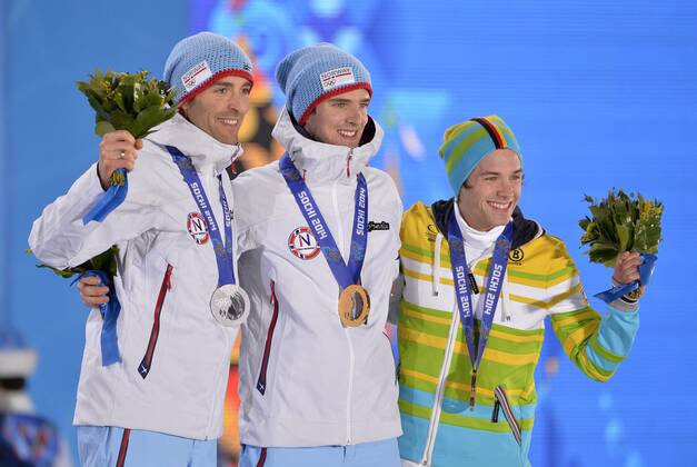 Norway s Magnus Hovdal Moan (L-R), Norway s Joergen Graabak and Germany s Fabian Riessle pose with their silver, gold and bronze medals during the victory ceremony for nordic combined individual Gunderson long hill 10km at the Sochi 2014 Winter Olympics on February 19, 2014 in Sochi, Russia.  OLY20140219135