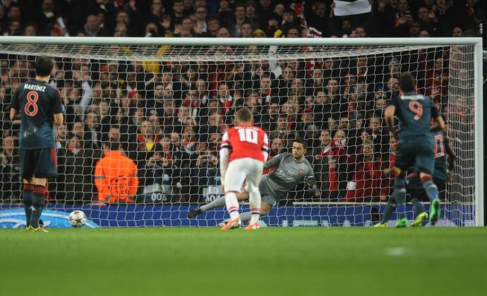 Football - 2013 2014 Champions League - Round of 16, First Leg: Arsenal vs. Bayern Munich Bayern s David Alaba misses his penalty kick past the replacement Fabianski at The Emirates. COLORSPORT ANDREW COWIE 