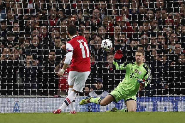 Arsenal s Mesut Özil sees his penalty saved by Munich s Manuel Neuer - FC Arsenal London vs FC Bayern Munich - UEFA Champions League - Emirates Stadium - London - England - 19 02 2014 - EDITORIAL USE ONLY. No use with unauthorised audio, video, data, fixture lists, club league logos or live services. Online in-match use limited to 120 images, no video emulation. No use in betting, games or single club league player publications.