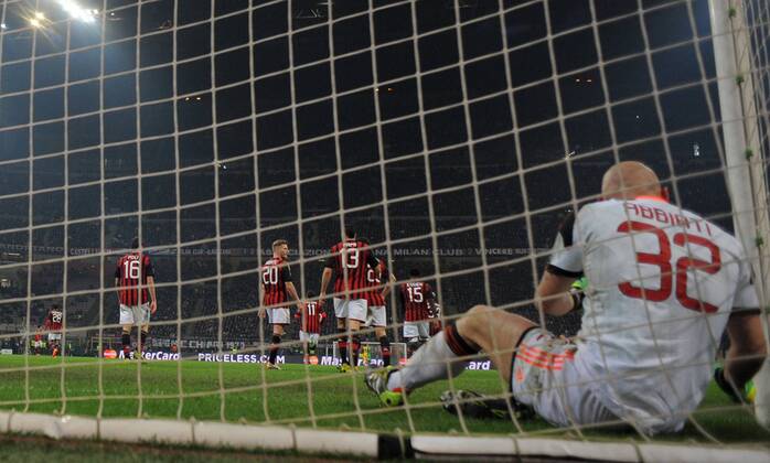 (140220) -- MILAN, Feb. 19, 2014 (Xinhua) -- AC Milan s goalkeeper Christian Abbiati (Front) reacts after Atletico Madrid s Diego Costa scored during their Champions League round of 16 first leg soccer match in Milan, Italy, Feb. 19, 2014. Atletico Madrid won 1-0. (Xinhua Alberto Lingria) (SP)ITALY-MILAN-CHAMPIONS LEAGUE-AC MILAN VS ATLETICO MADRID 